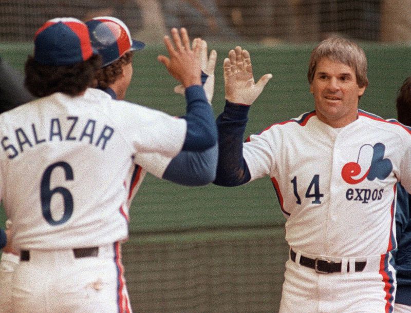 FILE - Montreal Expos Pete Rose celebrates his 4,000th career hit with teammates against the Philadelphia Phillies at Olympic Stadium in Montreal on April 13, 1984. (Ron Poling/The Canadian Press via AP, File)