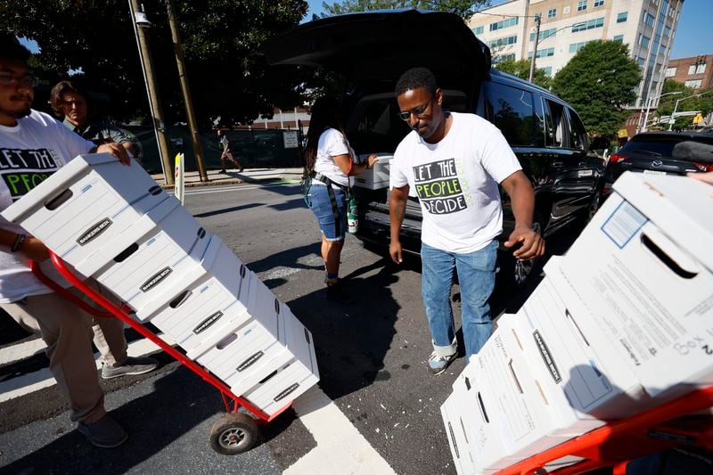 Forest defenders assisted in unloading sixteen boxes containing more than 100,000 signatures from a petition. They plan to submit this petition at City Hall on Monday, September 10, 2023, to have the matter of the training center included in the upcoming ballot.
Miguel Martinez /miguel.martinezjimenez@ajc.com