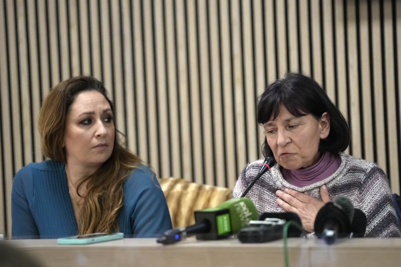 FILE - Lawyer Laura Sgro, left, listens to Gloria Branciani during a press conference in Rome, Wednesday, Feb. 21, 2024. Gloria Branciani, 59, is one of the first women who accused Rev. Marko Rupnik of spiritual, psychological and sexual abuse. Sgro wrote a letter representing five women who say they were psychologically, spiritually, and sexually abused by ex-Jesuit artist Rev. Marko Rupnik, that asks Catholic bishops around the world on Friday, June 28, 2024, to remove his mosaics from their churches, saying their continued display in places of worship was "inappropriate" and retraumatizing to victims. (AP Photo/Alessandra Tarantino, File)