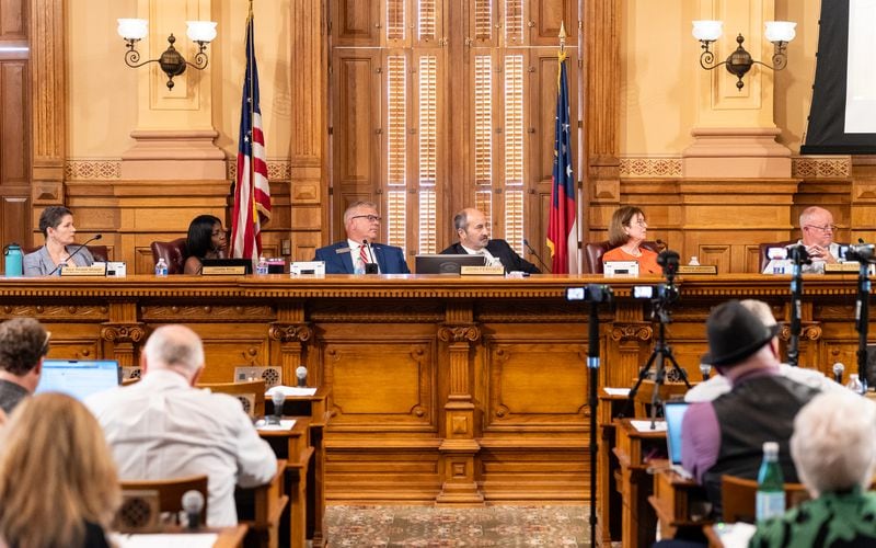 Members of the State Election Board listen to public comments during a meeting at the Georgia State Capitol in Atlanta on Tuesday.