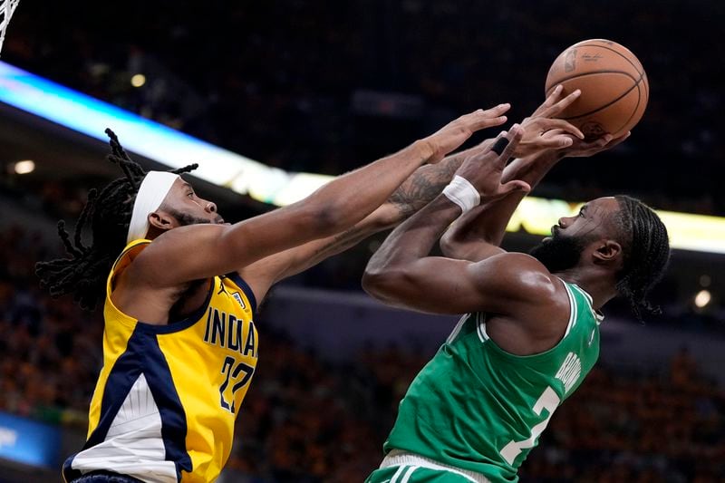 Boston Celtics guard Jaylen Brown (7) shoots over Indiana Pacers forward Isaiah Jackson (22) during the first half of Game 3 of the NBA Eastern Conference basketball finals, Saturday, May 25, 2024, in Indianapolis. (AP Photo/Michael Conroy)