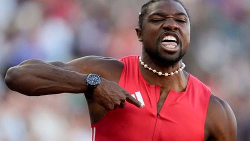 Noah Lyles celebrates after winning the men's 100-meter final during the U.S. Track and Field Olympic Team Trials Sunday, June 23, 2024, in Eugene, Ore. (AP Photo/Charlie Neibergall)