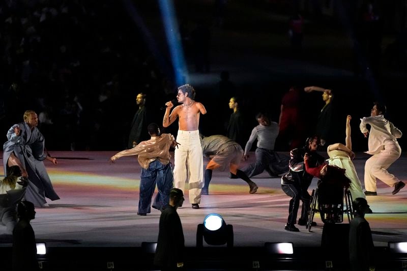 French artist Lucky Love sings during the Opening Ceremony for the 2024 Paralympics, Wednesday, Aug. 28, 2024, in Paris, France. (AP Photo/Michel Euler)