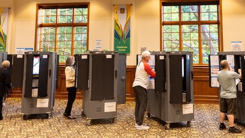 Fulton County voters cast ballots in the May 21 primary election at St. Luke’s Episcopal Church in Atlanta. (Arvin Temkar/The Atlanta Journal-Constitution)