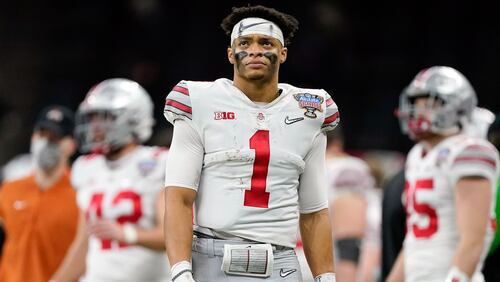 Ohio State quarterback Justin Fields goes No. 11 in the NFL draft to Chicago Bears. (AP Photo/John Bazemore, File)