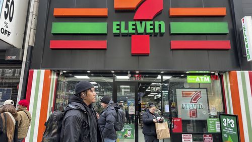 FILE - People shop at a 7-Eleven convenience store in New York, Tuesday, March 19, 2024. (AP Photo/Ted Shaffrey, File)