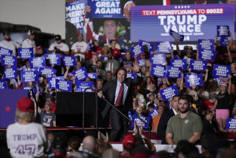 Pennsylvania Senate candidate Dave McCormick waves after speaking with Republican presidential nominee former President Donald Trump at a campaign rally Sunday, Sept. 29, 2024, in Erie, Pa. (AP Photo/Matt Rourke)