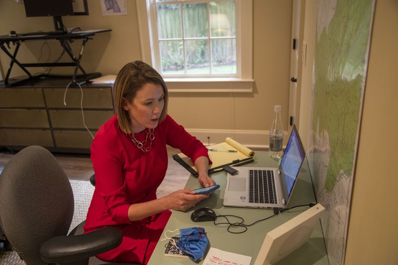 Lyndsey Rudder, Republican candidate for state House District 54,  speaks with her campaign finance director Amy Doehrman in her makeshift basement office at her residence in Atlanta on Sept. 14, 2020.  (Alyssa Pointer / Alyssa.Pointer@ajc.com)