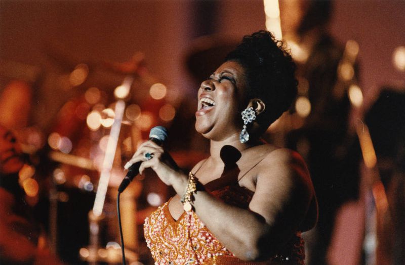 Aretha Franklin performs at Atlanta's Chastain Park Amphitheatre in 1993.