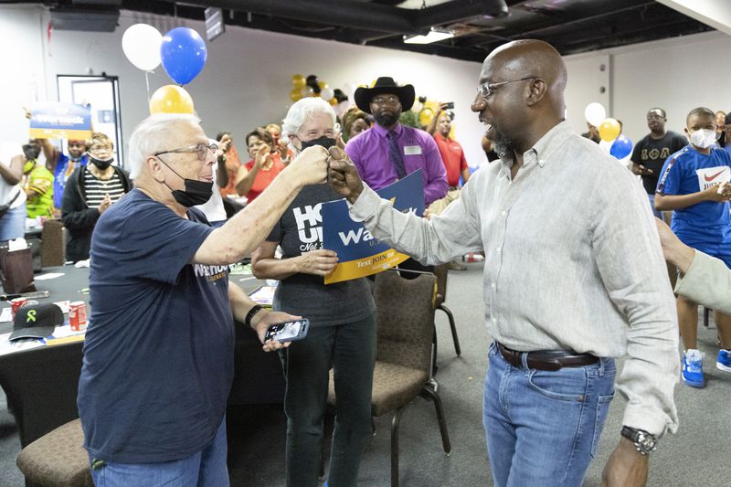 Senator Raphael Warnock greats the crowd during a rally in Atlanta, GA, on Saturday, July 23, 2022.  on Saturday, July 23, 2022.   (Bob Andres for the Atlanta Journal Constitution)