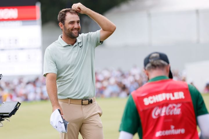 Scottie Scheffler reacts after winning the Tour Championship at East Lake Golf Club, Sunday, Sept. 1, 2023, in Atlanta. 
(Miguel Martinez / AJC)