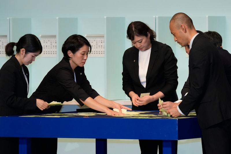 Officials count ballots during the Liberal Democratic Party's (LDP) leadership election at the LDP headquarters Friday, Sept. 27, 2024, in Tokyo. (AP Photo/Hiro Komae, Pool)