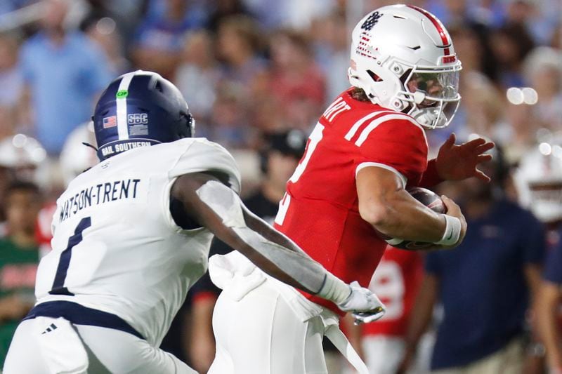 Mississippi quarterback Jaxson Dart (2) runs the ball as Georgia Southern linebacker Marques Watson-Trent (1) attempts a tackle during the first half of an NCAA college football game, Saturday, Sept. 21, 2024, in Oxford, Miss. (AP Photo/Sarah Warnock)