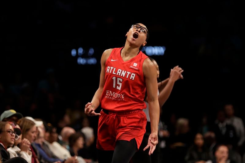 Atlanta Dream guard Allisha Gray reacts after making a 3-point basket during the first half of a first-round WNBA basketball playoff game against the New York Liberty, Tuesday, Sept. 24, 2024, in New York. (AP Photo/Adam Hunger)