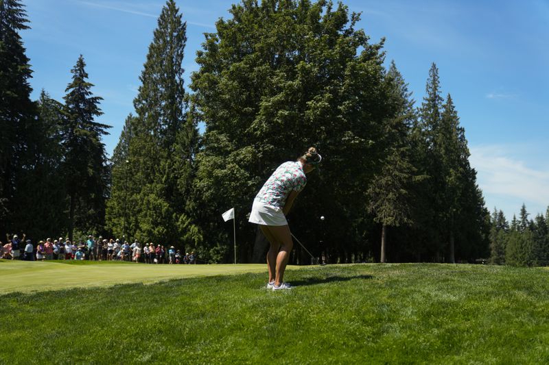 Lexi Thompson chips onto the eighth green during the second round of the Women's PGA Championship golf tournament at Sahalee Country Club, Friday, June 21, 2024, in Sammamish, Wash. (AP Photo/Gerald Herbert)