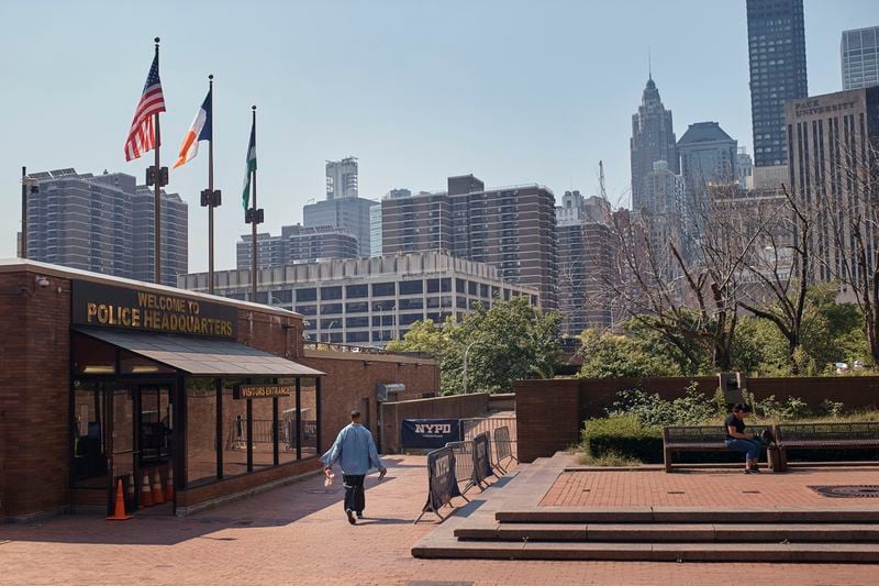 A man walks outside One Police Plaza NYPD Headquarters on Friday, Sept. 13, 2024, in New York. (AP Photo/Andres Kudacki)