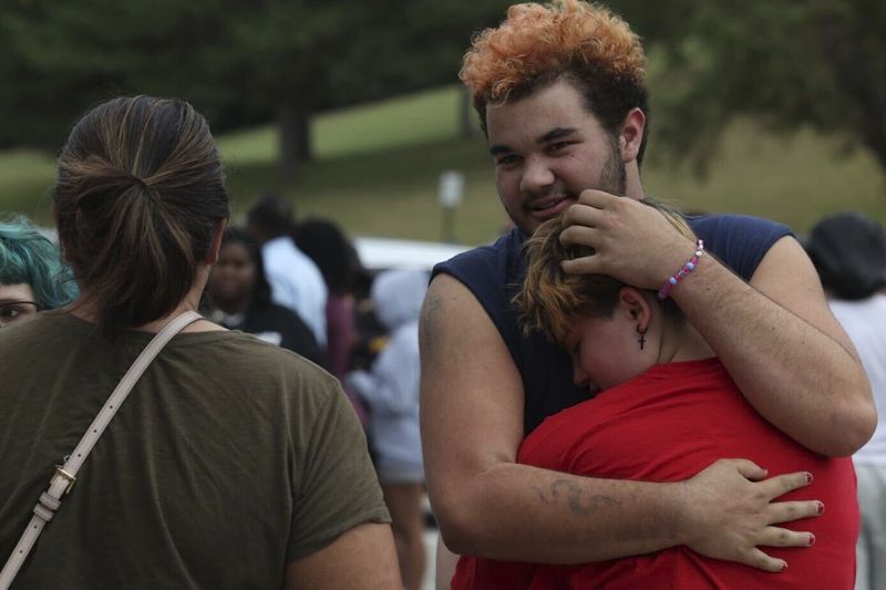 Artemis Else, right, hugs Angie Caswell as they wait outside Northwest high school after a shooting was reported Tuesday, Sept. 10, 2024, in Omaha, Neb. (Megan Nielsen/Omaha World-Herald via AP)