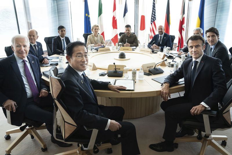 FILE - Ukrainian President Volodymyr Zelenskyy, center rear, joins G7 world leaders at a working session on the final day of the G7 Summit in Hiroshima, Japan, on May 21, 2023. From left to right are: Japan's Prime Minister Fumio Kishida, U.S. President Joe Biden, German Chancellor Olaf Scholz, Britain's Prime Minister Rishi Suna, European Commission President Ursula von der Leyen, Zelenskyy, European Council President Charles Michel, Gianluigi Benedetti, Italian ambassador to Japan, Canada's Prime Minister Justin Trudeau, and France's President Emmanuel Macron. (Stefan Rousseau/Pool Photo via AP, File)