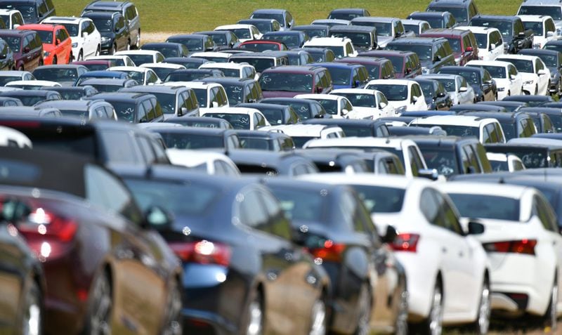 Thousands of rental cars from Enterprise parked at parking lots of Atlanta Motor Speedway in Hampton on Tuesday, May 12, 2020. The coronavirus has caused rental car demand to plummet so Enterprise sought a place to store their cars. (Hyosub Shin / Hyosub.Shin@ajc.com)