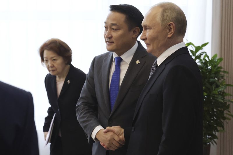 Russian President Vladimir Putin, right, and Chairman of the State Great Hural (Parliament) of Mongolia Dashzegve Amarbayasgalan attend a meeting at the Government Palace in Ulaanbaatar, Mongolia, Tuesday, Sept. 3, 2024. (Vyacheslav Prokofyev, Sputnik, Kremlin Pool Photo via AP)