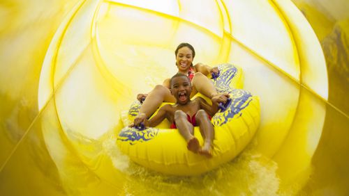 Bubbly fun: A mom and son hold on while enjoying a slide at Great Wolf Lodge. 
(Courtesy of Great Wolf Lodge)