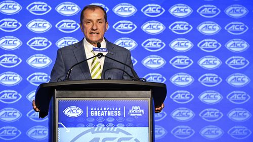 ACC commissioner Jim Phillips speaks during a news conference at the ACC media days, Monday, July 22, 2024, in Charlotte, N.C. (AP Photo/Matt Kelley)