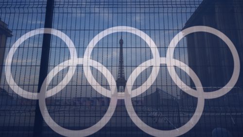 FILE - The Eiffel Tower is seen behind the Olympic rings, at the Trocadero plaza Thursday, July 18, 2024 in Paris. (AP Photo/David Goldman, File)