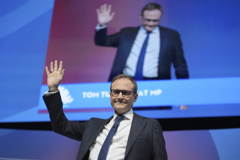 Conservative leadership candidate Tom Tugendhat waves to members during the Conservative Party Conference at the International Convention Centre in Birmingham, England, Wednesday, Oct. 2, 2024.(AP Photo/Kin Cheung)