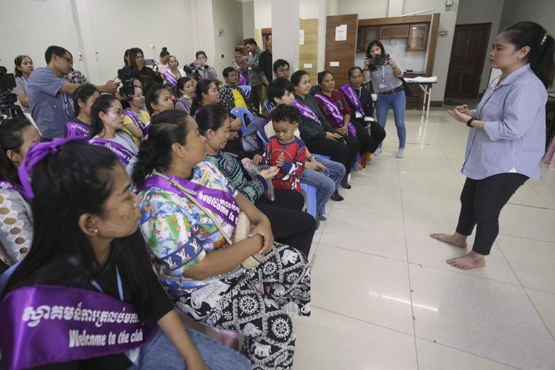 Chhim Sithar, right, a union leader being freed from prison after serving time for her part in a strike against the country’s biggest casino, speaks to her supporters at a club on the outskirts of Phnom Penh Cambodia, Monday, Sept. 16, 2024. (AP Photo/Heng Sinith)