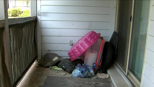 Neighbors at the Hidden Valley Apartments on Misty Waters Drive said the apartment where the 7-year-old's body was found was vacant for many months, but there had been a history of squatters.