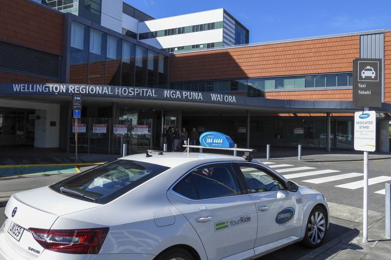 A taxi waits at a stand outside the Wellington Regional Hospital, written in English and Maori languages as New Zealand celebrates its annual Maori language week in Wellington, New Zealand, Wednesday, Sept. 18, 2024. (AP Photo/Charlotte GrahamMcLay)