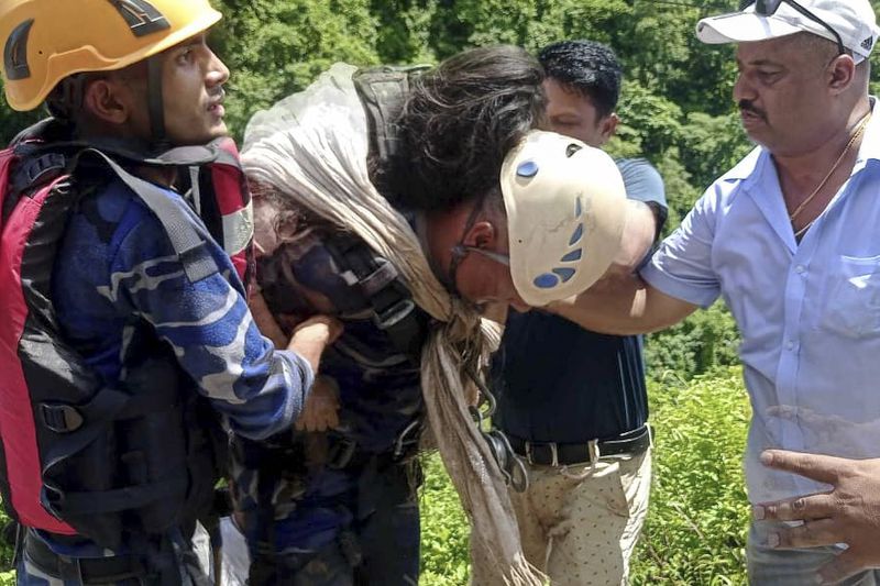 This photograph provided by Nepal Armed Police Force (APF) shows APF personnel carrying out rescue operation after a bus carrying Indian pilgrims fell into a river near Abukhaireni town, about 75 miles west of the capital, Kathmandu, Nepal, Friday, Aug. 23, 2024. (Nepal Armed Police Force via AP)