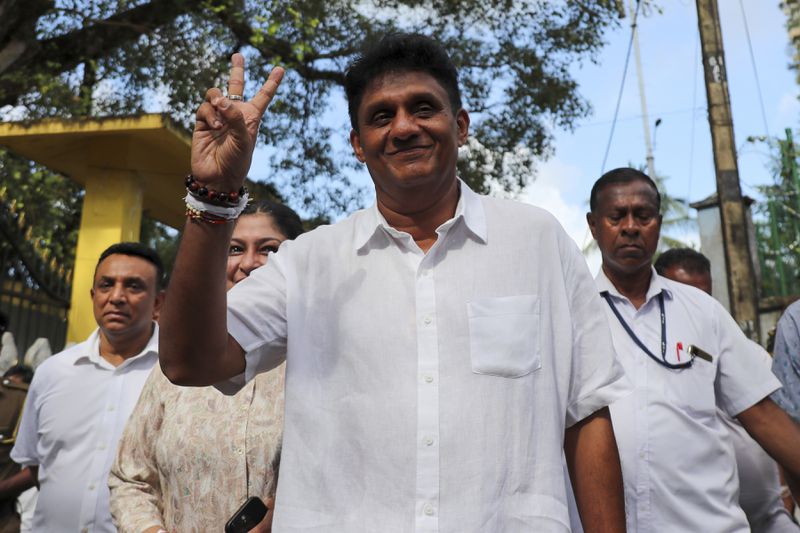 Sajith Premadasa, opposition leader and the presidential candidate of United People's Power or Samagi Jana Balawegaya party, gestures as he leaves a polling station after casting his vote, in Colombo, Sri Lanka, Saturday, Sept. 21, 2024. (AP Photo)