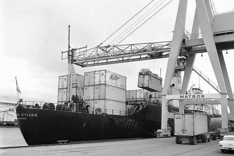 FILE - Cargo containers which can be hoisted from trucks to and from ships are loaded aboard the Matson Hawaiian Citizen at a San Francisco pier on May 15, 1963. (AP Photo, File)