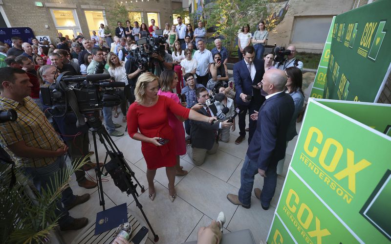 Gov. Spencer Cox and Lt. Gov. Deidre Henderson talk with media during a primary election night party in Salt Lake City, Tuesday, June 25, 2024. (Jeffrey D. Allred/The Deseret News via AP)