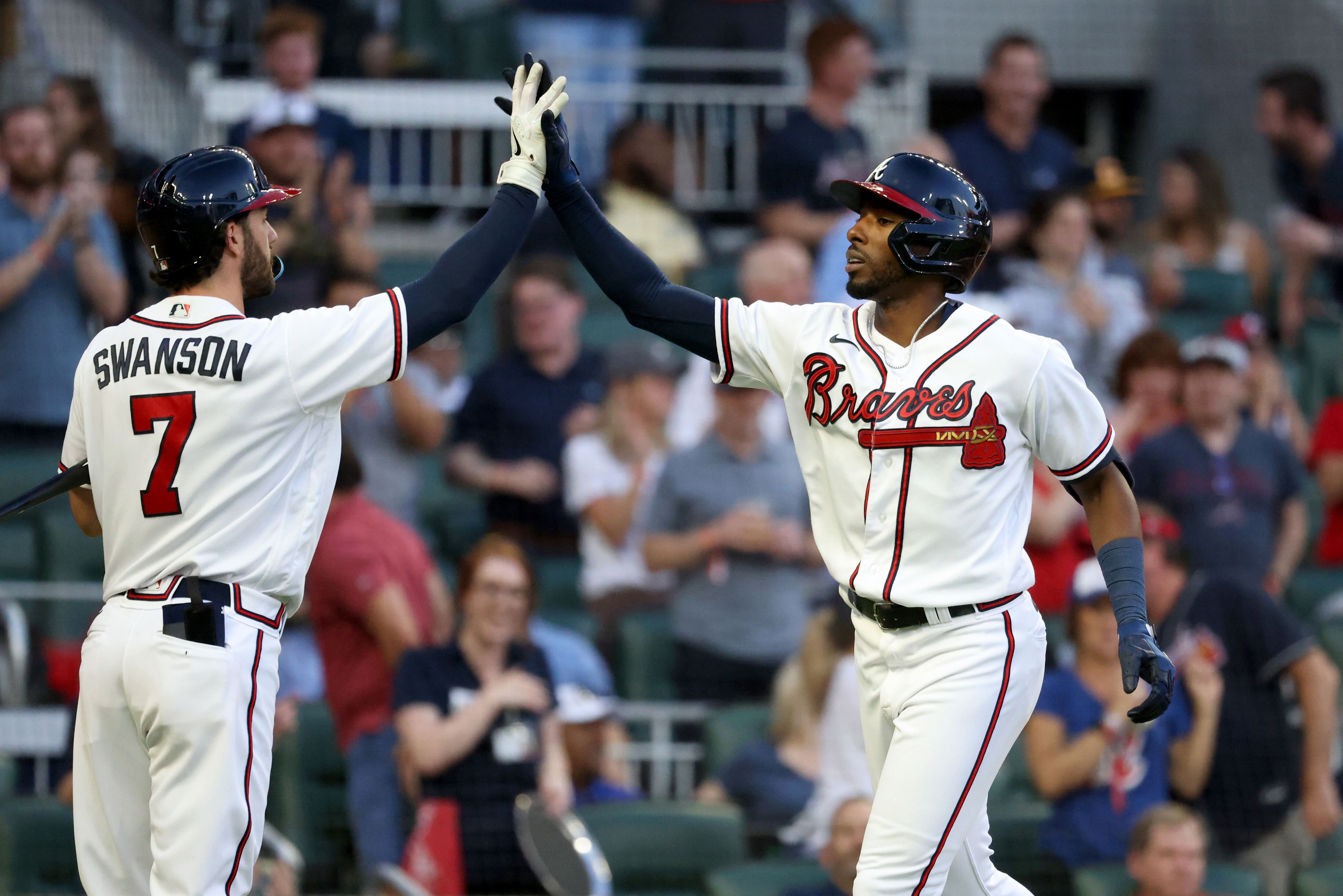 ATLANTA, GA - APRIL 06: Atlanta Braves shortstop Orlando Arcia (11)  celebrates with his team after hitting a walk-off base hit during the Braves  2023 home opener MLB game between the Atlanta