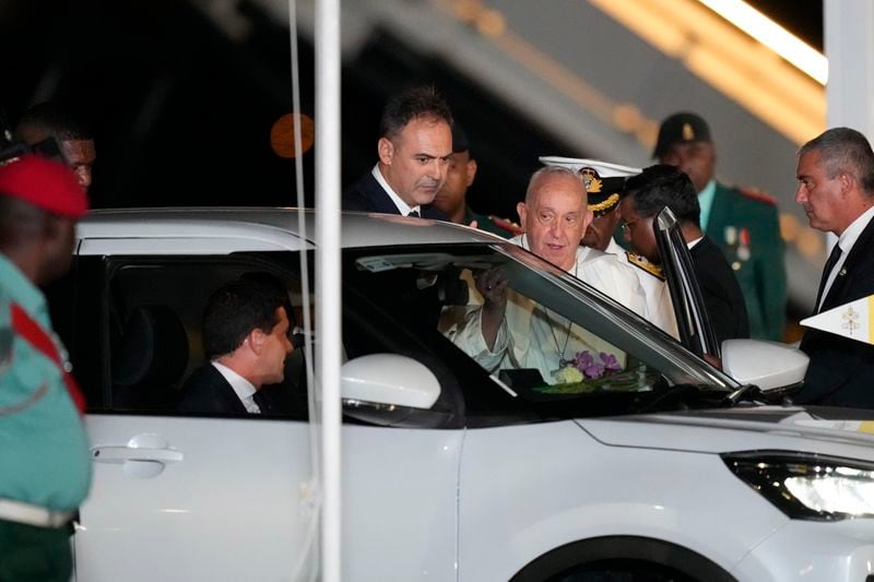 Pope Francis boards a waiting car at Jackson's International Airport in Port Moresby, Papua New Guinea, Friday, Sept. 6, 2024. (AP Photo/Mark Baker)