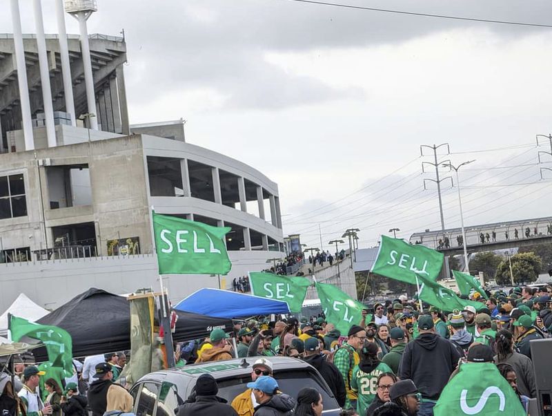 Oakland A's fan staged a rally urging team owner John Fisher to sell to a buyer who will keep the franchise in Oakland in the Coliseum parking lot on March 28, 2024 - the Opening Day of the season - in Oakland, Calif. (AP Photo/Michael Liedtke)