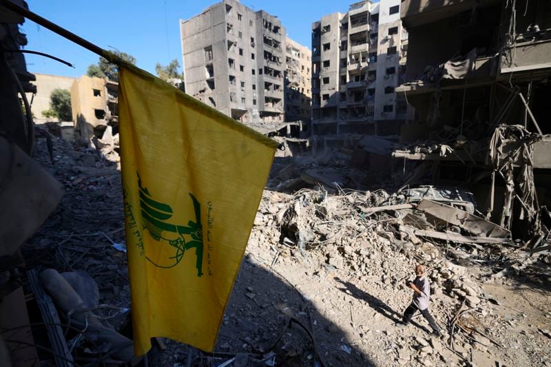 A Hezbollah flag at the site of the assassination of Hezbollah leader Hassan Nasrallah in Beirut's southern suburbs, Sunday, Sept. 29, 2024. (AP Photo/Hassan Ammar)