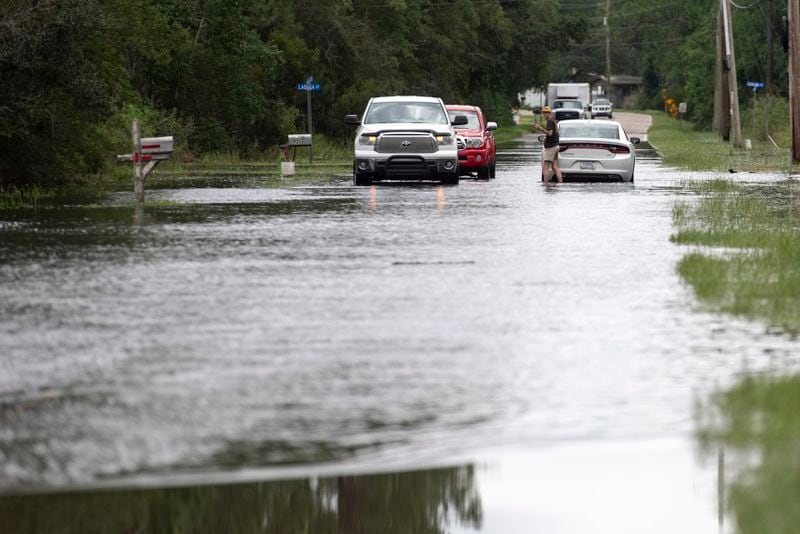 A motorist gets stuck in flood waters along Kiln-Waveland Cutoff Road in the Shoreline Park neighborhood in Hancock County, Miss., after Hurricane Francine on Thursday, Sept. 12, 2024. (Hannah Ruhoff/The Sun Herald via AP)