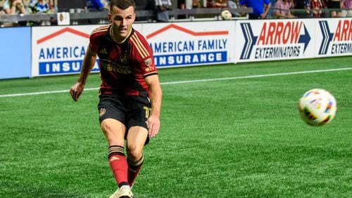 Brooks Lennon passes the ball for a goal attempt during the Atlanta United game against Columbus Crew at Mercedes Benz Stadium in Atlanta, GA on July 20, 2024. (Jamie Spaar for the Atlanta Journal Constitution)