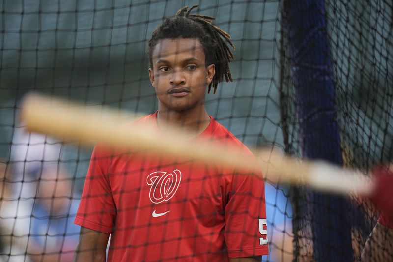 Washington Nationals' CJ Abrams watches batting practice before a baseball game against the Chicago Cubs, Thursday, Sept. 19, 2024, in Chicago. (AP Photo/Erin Hooley)