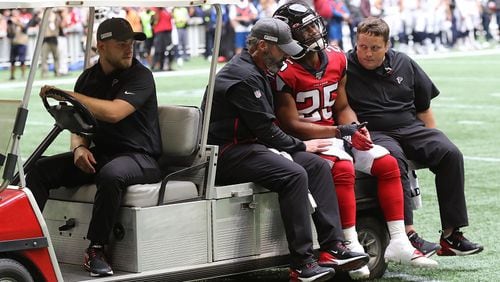 Falcons running back Ito Smith leaves the game injured during the first half against the Los Angeles Rams on Sunday, October 20, 2019, in Atlanta. Curtis Compton/ccompton@ajc.com