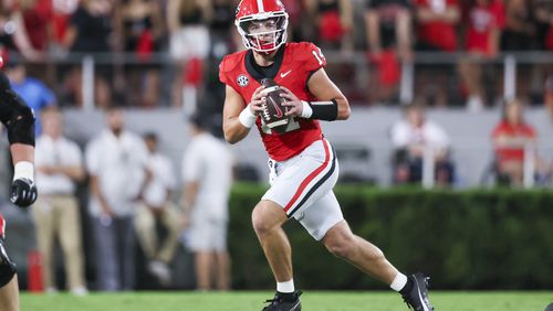 Georgia quarterback Gunner Stockton (14) looks to pass during the fourth quarter against Tennessee-Martin at Sanford Stadium, Saturday, September 2, 2023, in Athens. Georgia won 48-7. (Jason Getz / Jason.Getz@ajc.com)