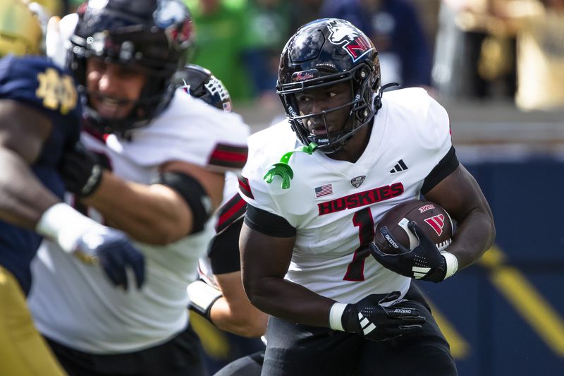 Northern Illinois running back Antario Brown (1) runs the ball during an NCAA college football game against Notre Dame, Saturday, Sept. 7, 2024, in South Bend, Ind. (AP Photo/Michael Caterina)