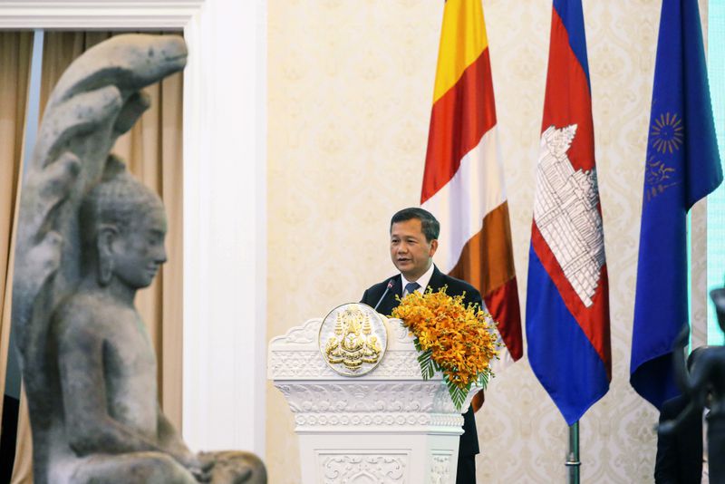 In this photo released by Agence Kampuchea Press (AKP), Cambodian Prime Minister Hun Manet delivers a speech during a ceremony for the return of artifacts at Peace Palace in Phnom Penh, Cambodia, Thursday, Aug. 22, 2024. (AKP via AP)