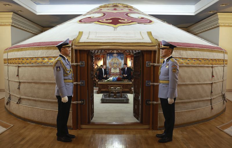 Russian President Vladimir Putin, centre left, and Mongolian President Ukhnaagiin Khurelsukh attend their meeting at the Saaral Ordon Government Building in Ulaanbaatar, Mongolia, Tuesday, Sept. 3, 2024. (Vyacheslav Prokofyev, Sputnik, Kremlin Pool Photo via AP)