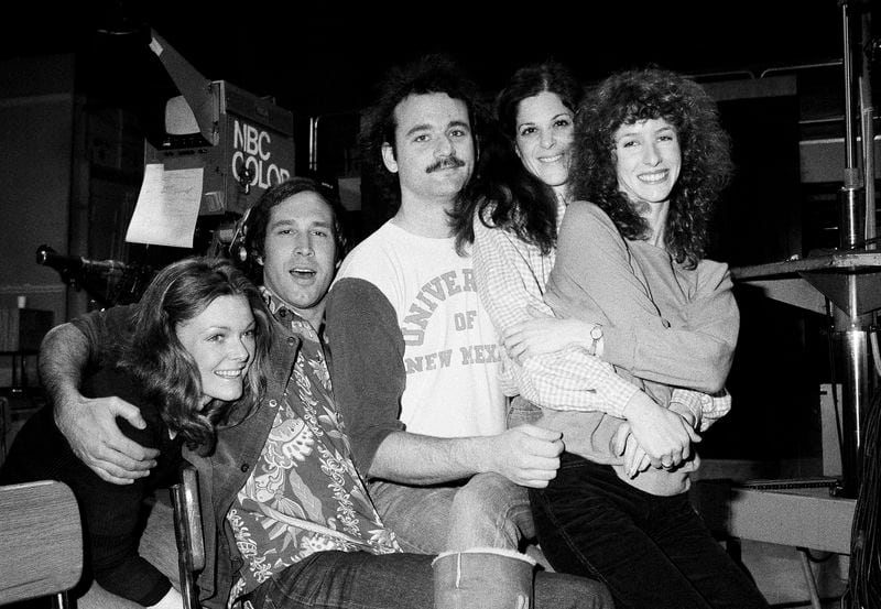 FILE - Comedian Chevy Chase, second from left, joins the cast of NBC's "Saturday Night Live," with Laraine Newman, from right, Gilda Radner, Bill Murray and Jane Curtain, left, on Feb. 16, 1978 in New York. (AP Photo/Marty Lederhandler, File)