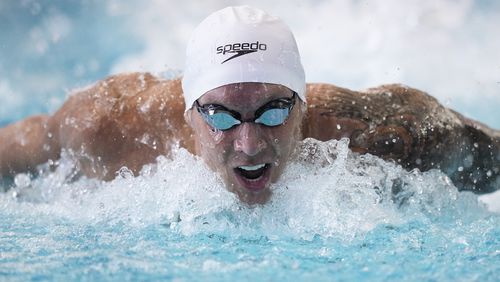 FILE - Caeleb Dressel swims the men's 100 butterfly during the Speedo Atlanta Classic finals Friday, May 12, 2023, in Atlanta. (AP Photo/Brynn Anderson, File)