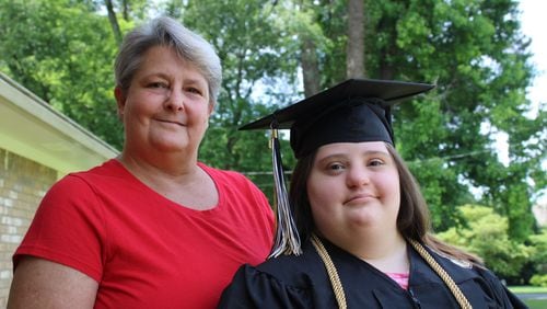 Ashlynn Rich, right, poses with her mother, Linda Ramirez. Ashlynn graduated from Sprayberry High School in May and was excluded from the full ceremony along with other special needs students. (Photo Courtesy of Annie Mayne)